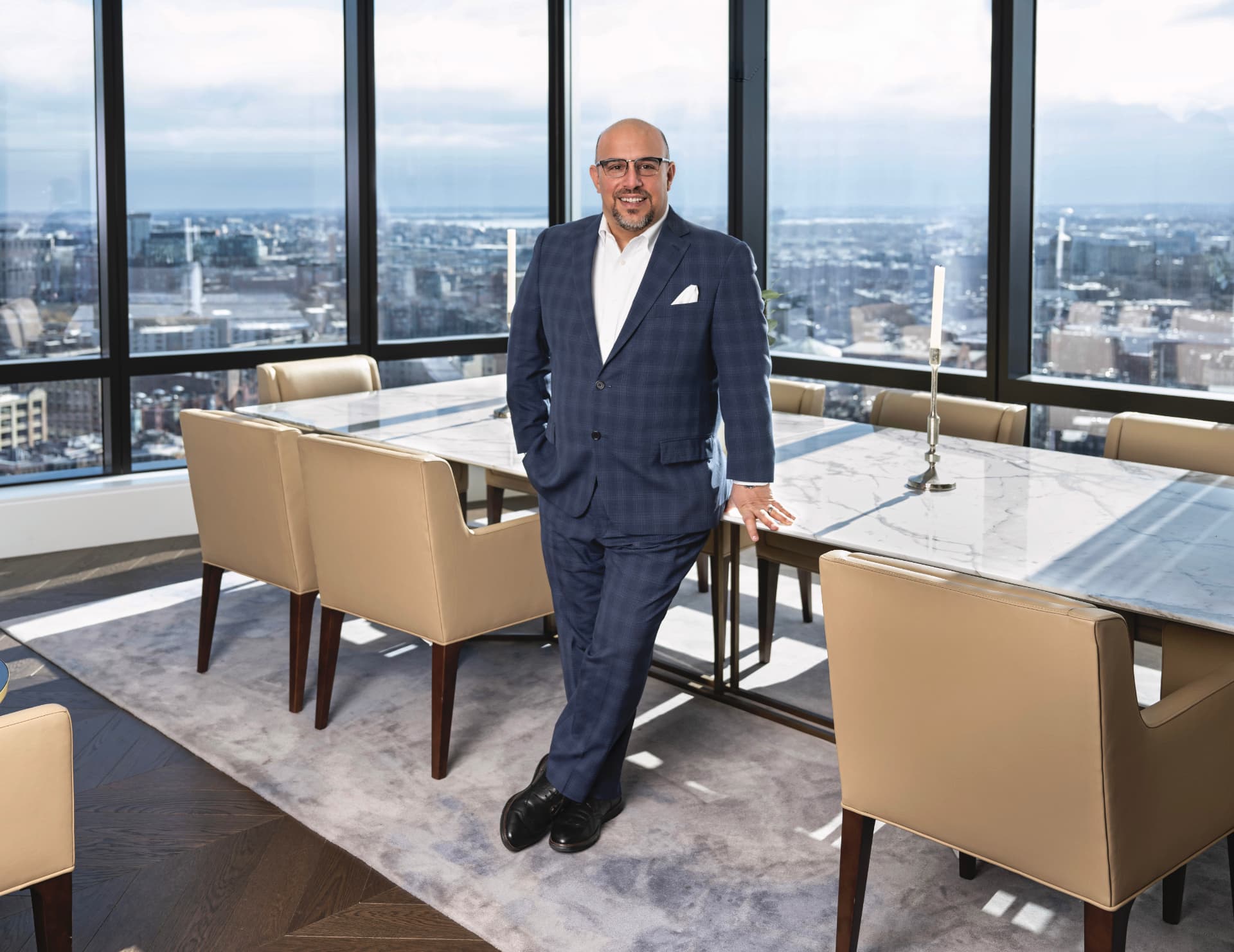 John J. Dean Jr., Global Real Estate Advisor with Engel & Völkers, in a Boston high-rise residence overlooking the city