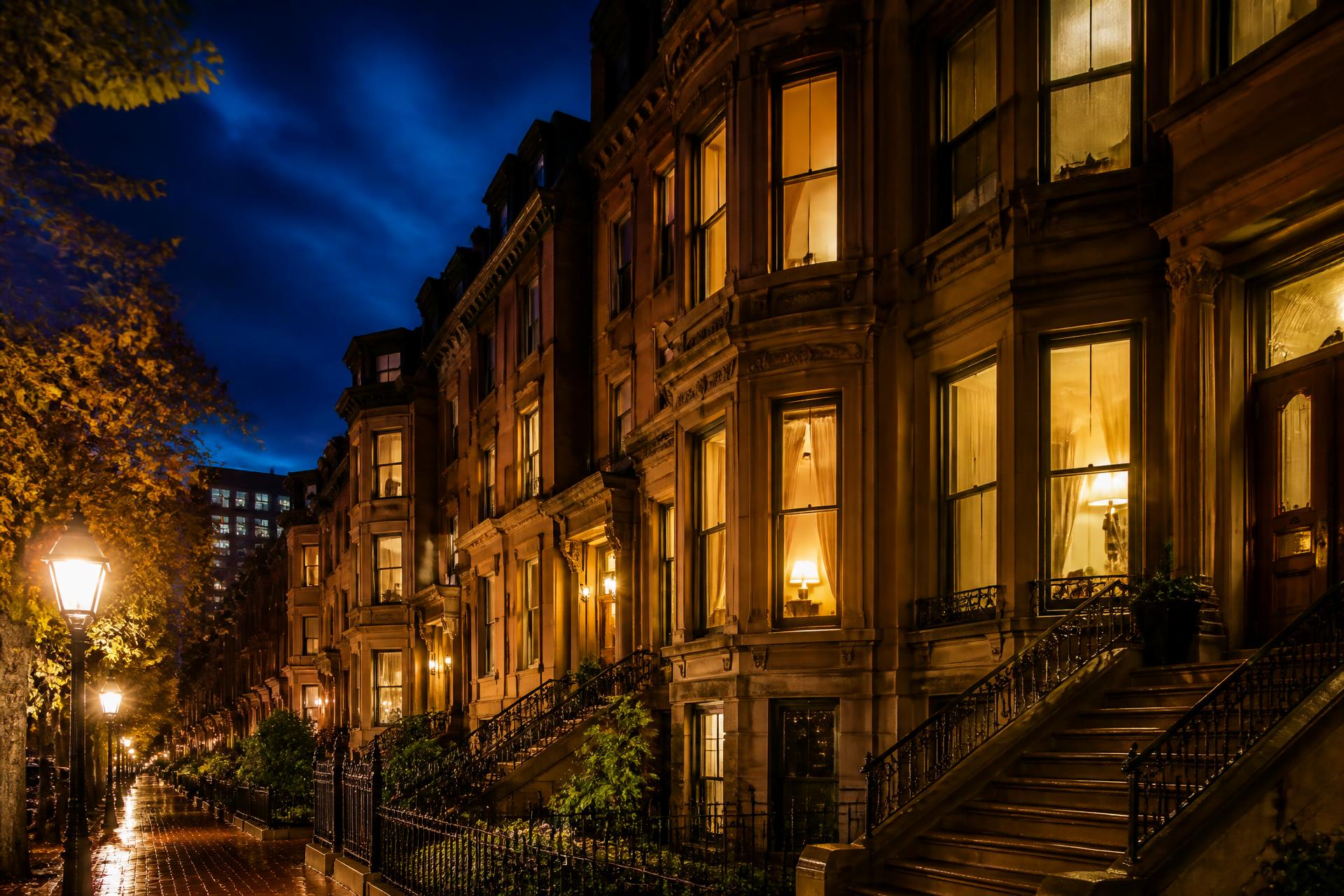 Illuminated Boston brownstones at dusk near the medical campuses